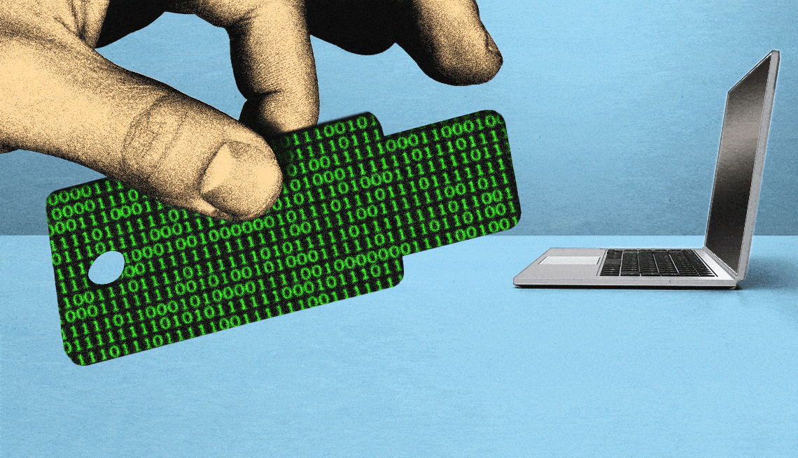 Do you need a computer security passkey? hand holding a computer passkey with animated zeros and ones on it the laptop is in the background