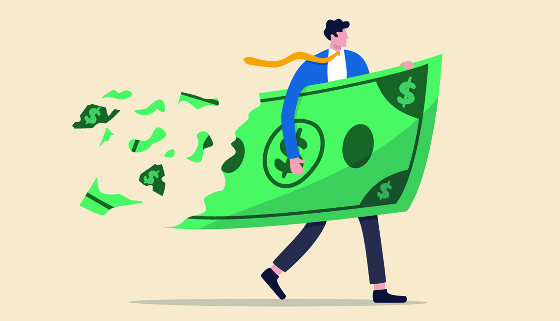 Man. holding a giant dollar bill that is disintegrating and being ripped off behind his back