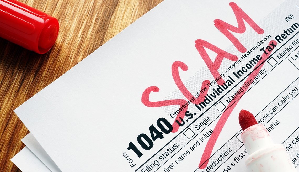 tax return form marked  as scam on a desk
