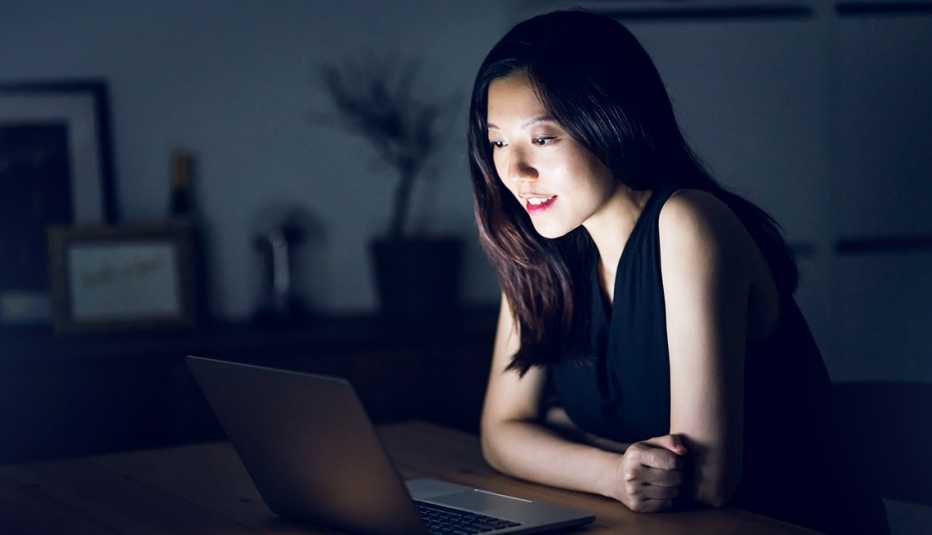 A woman looking at a computer