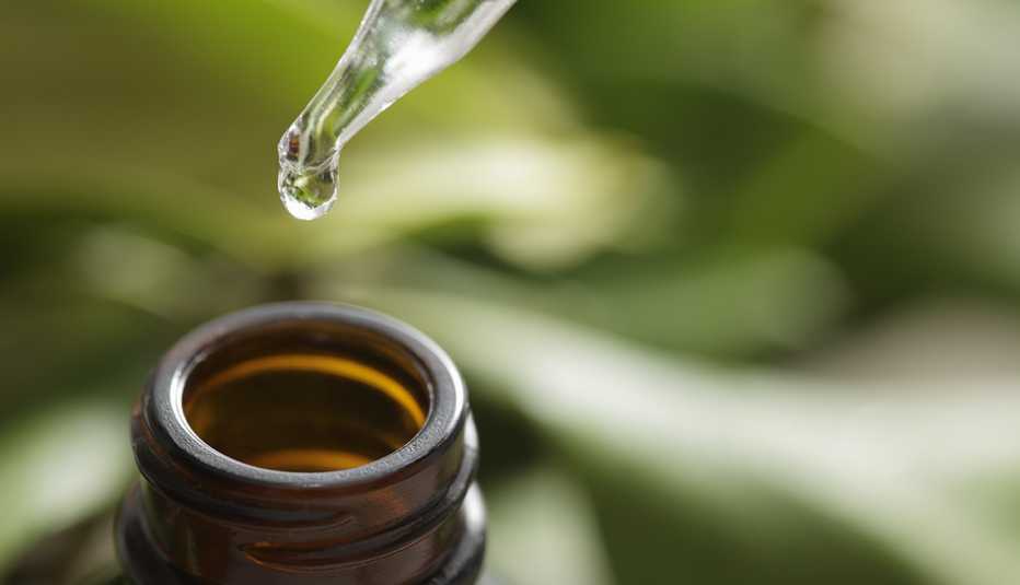 Brown herbal extraction bottle with a dropper.