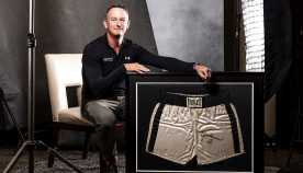 thomas ruggie with framed boxing trunks that were﻿ worn by muhammad ali