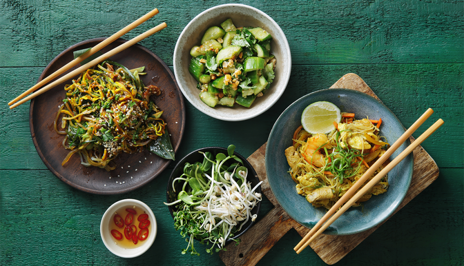 An overhead view of different bowls of Japanese food